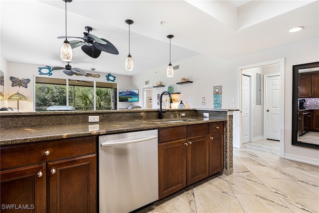 kitchen with ceiling fan, decorative light fixtures, dark stone countertops, stainless steel dishwasher, and sink