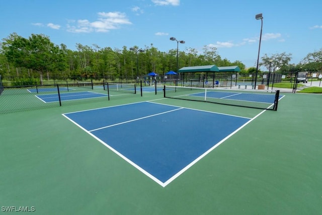 view of sport court featuring basketball hoop