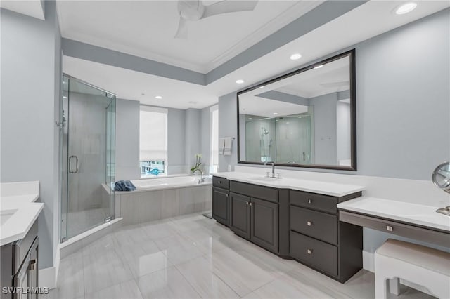 bathroom featuring ceiling fan, vanity, crown molding, and plus walk in shower