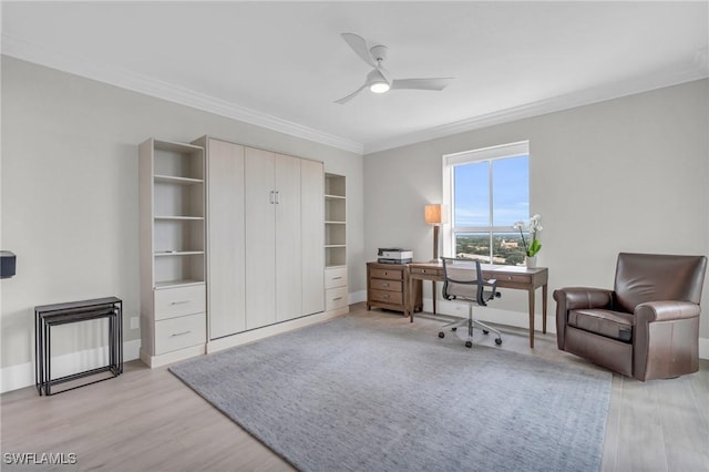 office with light wood-style floors, baseboards, ornamental molding, and ceiling fan