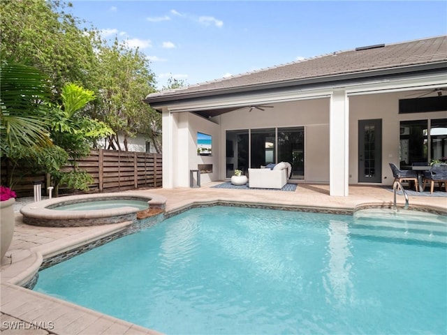 view of swimming pool featuring an in ground hot tub, a patio area, and ceiling fan