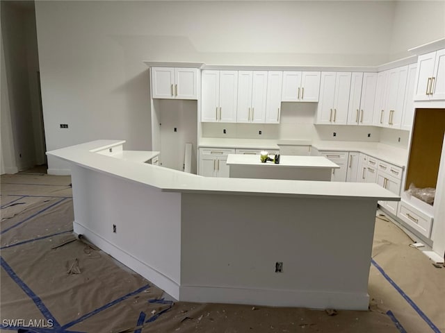 kitchen with a spacious island and white cabinets