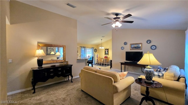 carpeted living room featuring lofted ceiling and ceiling fan