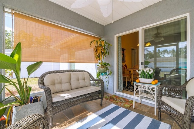 sunroom / solarium with ceiling fan