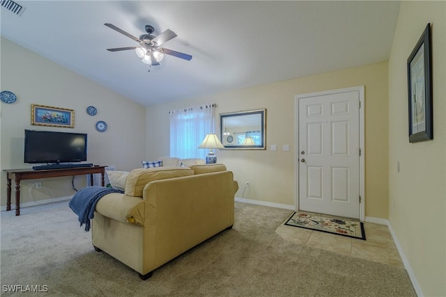 living room featuring light carpet, lofted ceiling, and ceiling fan