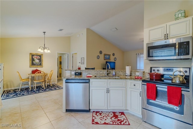 kitchen with white cabinetry, appliances with stainless steel finishes, sink, and hanging light fixtures