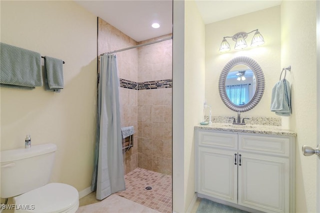 bathroom with toilet, vanity, and a shower with curtain