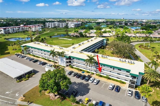 aerial view with view of golf course and a water view