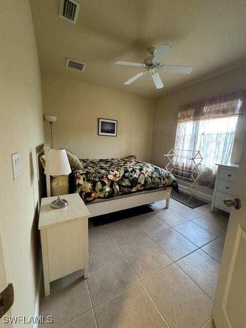 bedroom with ceiling fan and light tile patterned floors