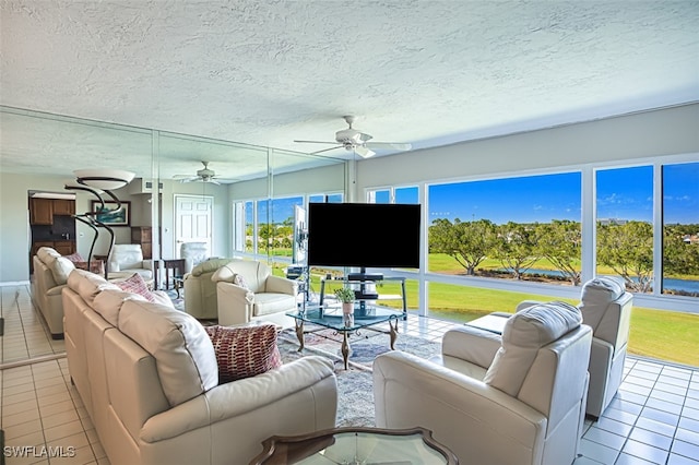 sunroom featuring ceiling fan