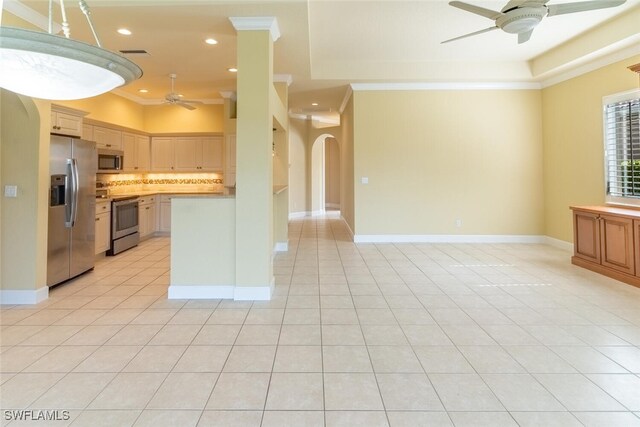 kitchen featuring ceiling fan, decorative backsplash, light tile patterned flooring, stainless steel appliances, and ornamental molding