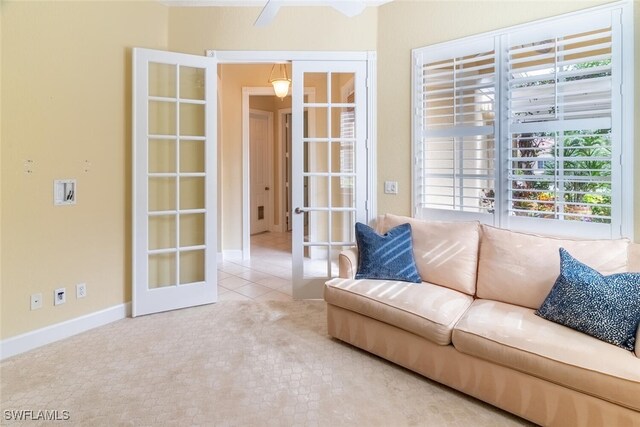 unfurnished living room featuring french doors and light tile patterned flooring