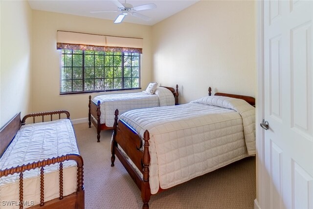 bedroom with ceiling fan and carpet flooring