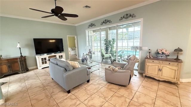 living room with ornamental molding, ceiling fan, and light tile patterned flooring