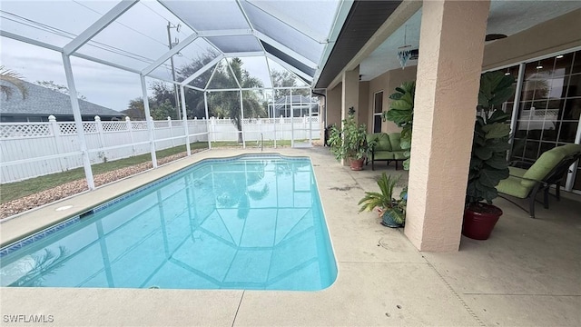 view of pool with a lanai and a patio