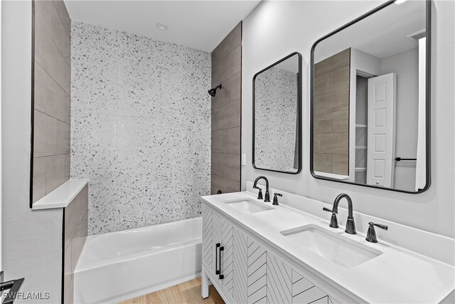 bathroom with vanity and a bathing tub