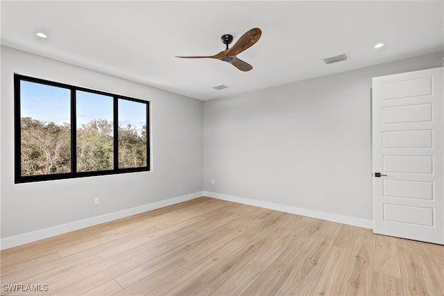 unfurnished room with ceiling fan and light wood-type flooring