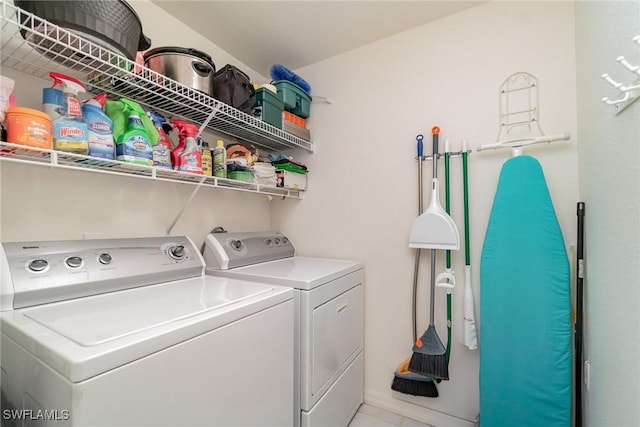 clothes washing area with separate washer and dryer