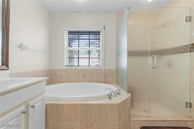 bathroom featuring vanity and plus walk in shower