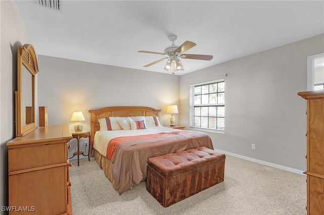 bedroom with light carpet and ceiling fan