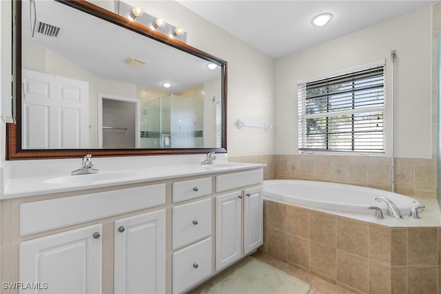 bathroom featuring vanity and plus walk in shower