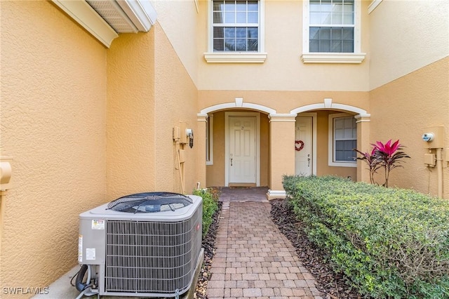 property entrance with central AC unit