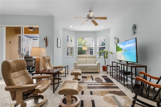 living area with ceiling fan and light tile patterned flooring