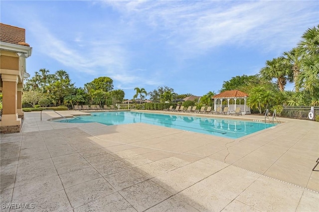 view of swimming pool with a gazebo and a patio