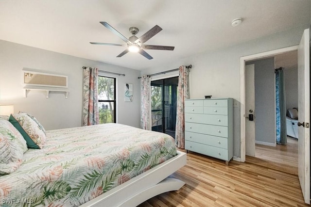 bedroom featuring light wood-type flooring, access to outside, and ceiling fan