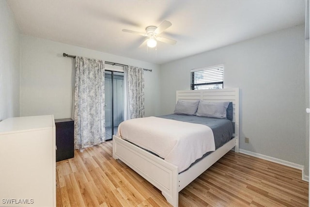 bedroom with light wood-style floors, baseboards, and a ceiling fan