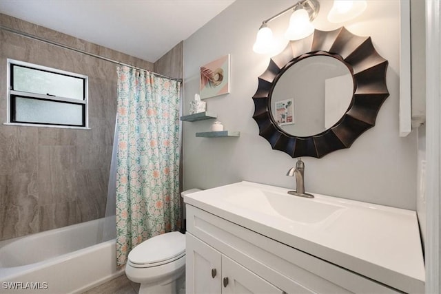 bathroom featuring toilet, shower / tub combo, and vanity