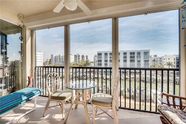 sunroom / solarium with ceiling fan