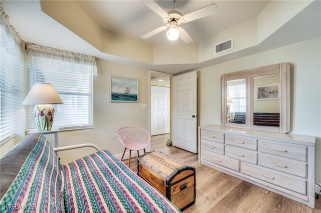 bedroom with ceiling fan and light hardwood / wood-style flooring