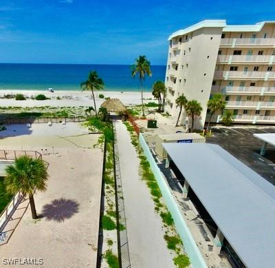 property view of water featuring a beach view