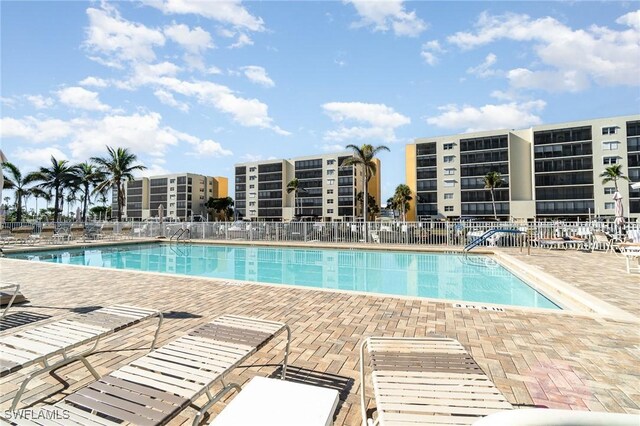 view of swimming pool with a patio