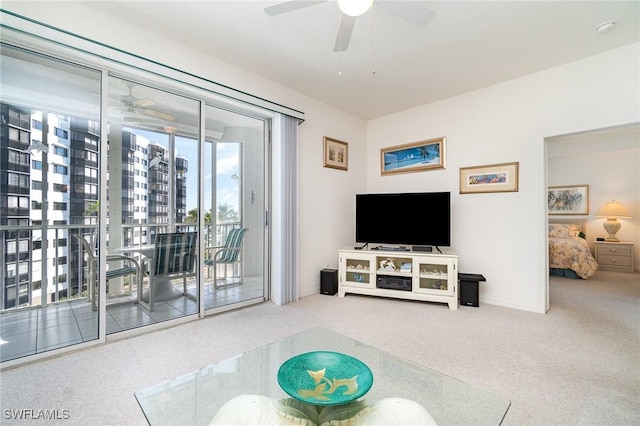 living room featuring ceiling fan and carpet flooring