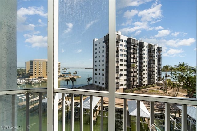 balcony featuring a water view