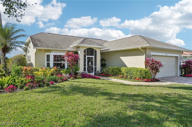 ranch-style home with a garage and a front yard