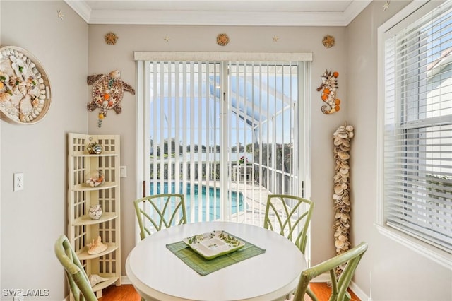 dining area featuring crown molding