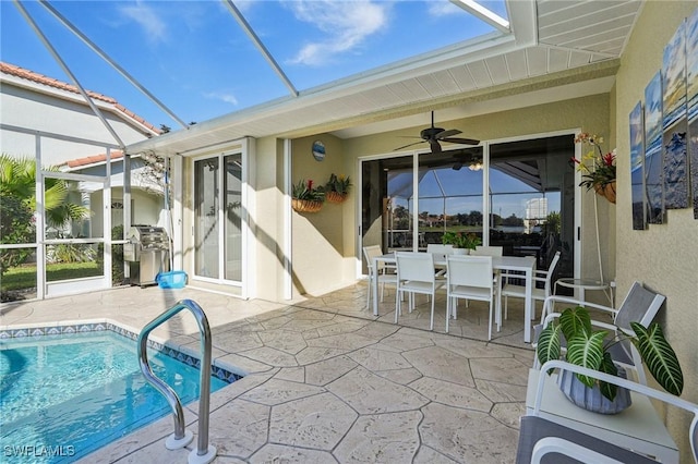 exterior space featuring ceiling fan, a lanai, and a patio area