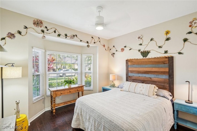 bedroom with dark wood-type flooring and ceiling fan