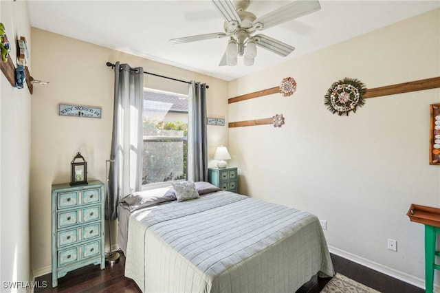 bedroom featuring dark wood-type flooring and ceiling fan