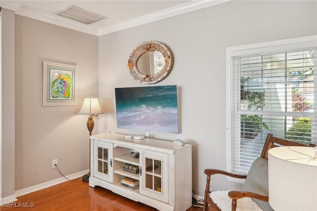 sitting room featuring hardwood / wood-style flooring and ornamental molding