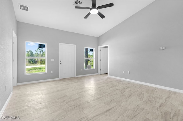 unfurnished room featuring ceiling fan and high vaulted ceiling