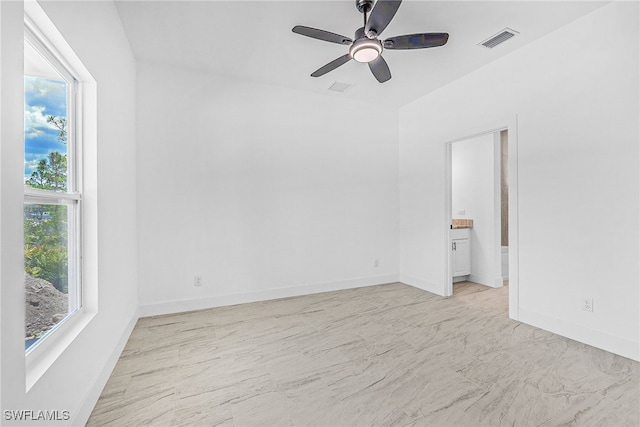 27141 Alhambra Dr, Punta Gorda, FL 33955 - spare room featuring a ceiling fan and light marble finish floors
