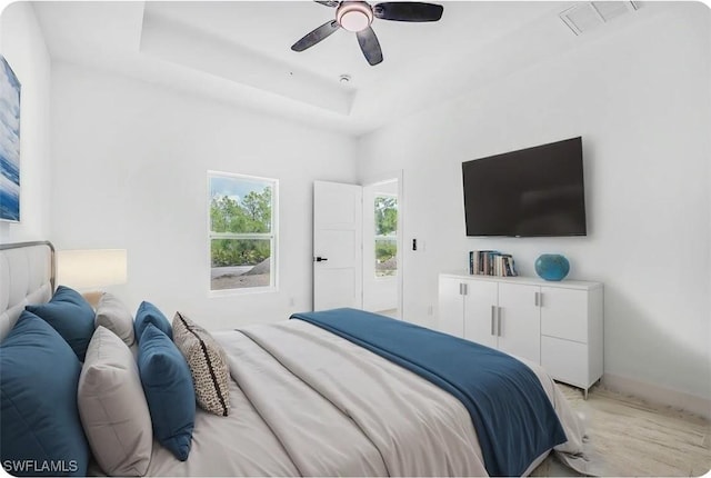 27141 Alhambra Dr, Punta Gorda, FL 33955 - bedroom with a ceiling fan and a tray ceiling
