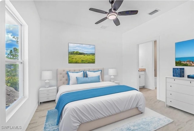 27141 Alhambra Dr, Punta Gorda, FL 33955 - bedroom featuring ensuite bath and a ceiling fan