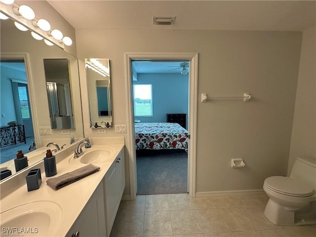 bathroom featuring vanity, ceiling fan, tile patterned floors, and toilet