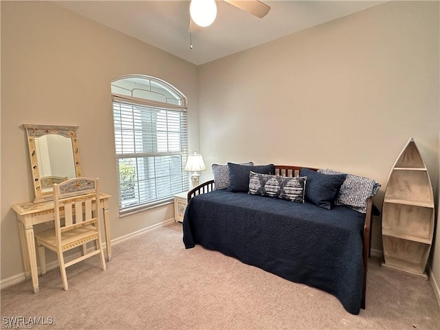 bedroom with light carpet and ceiling fan