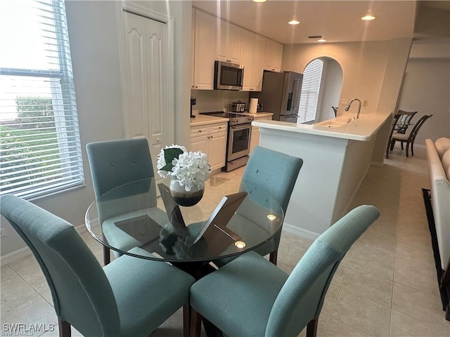 tiled dining space with sink